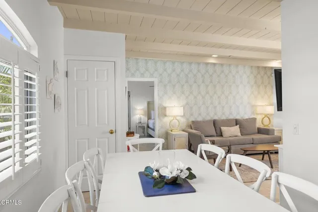 a bed room with a bed and a potted plant