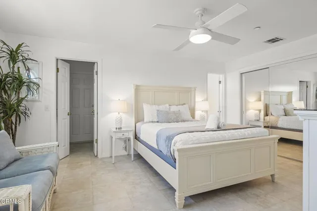 a bathroom with a double vanity sink mirror and bathtub