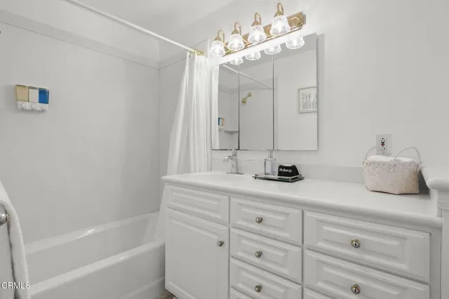 a bed room with furniture and a flat screen tv