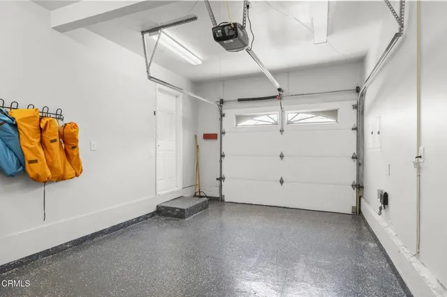 a bathroom with double vanity a mirror and a sink