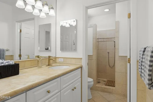 an aerial view of residential houses with city view