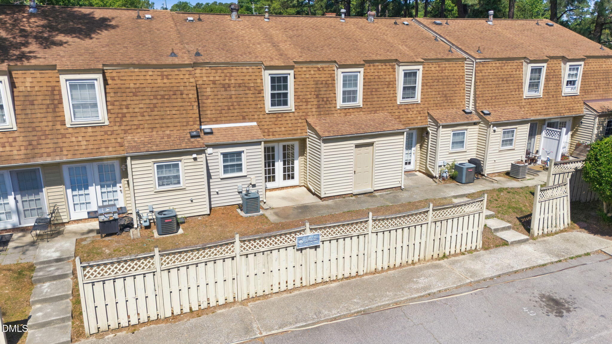 145 Jones Franklin Road, Unit D Raleigh, NC 27606 - Photo 20 of 23 front view of a house with a fence