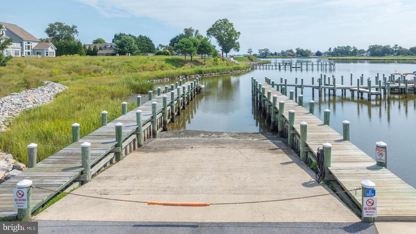 31250 Anchor Watch Loop, Unit 78 Dagsboro, DE 19939 - Photo 3 of 5 a view of a lake with a outdoor space