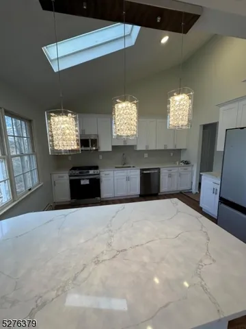 a large kitchen with a large window