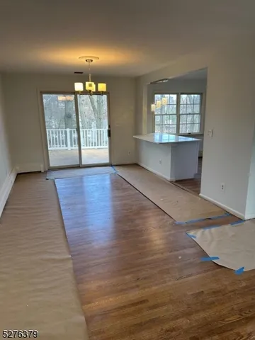 a bathroom with a granite countertop sink a toilet and a mirror