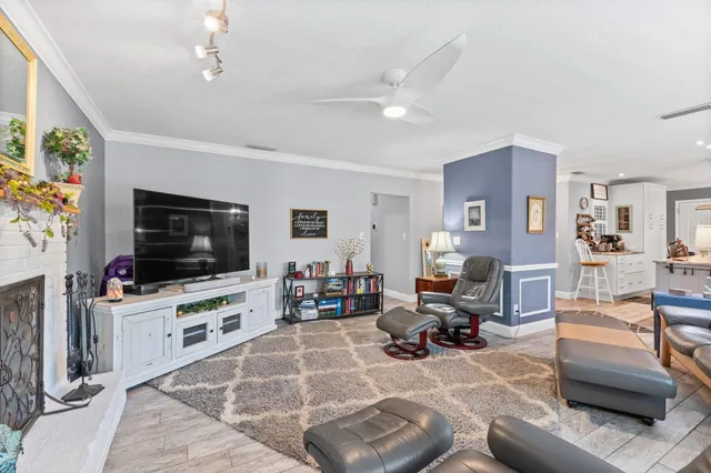 a dining table with chairs and kitchen view