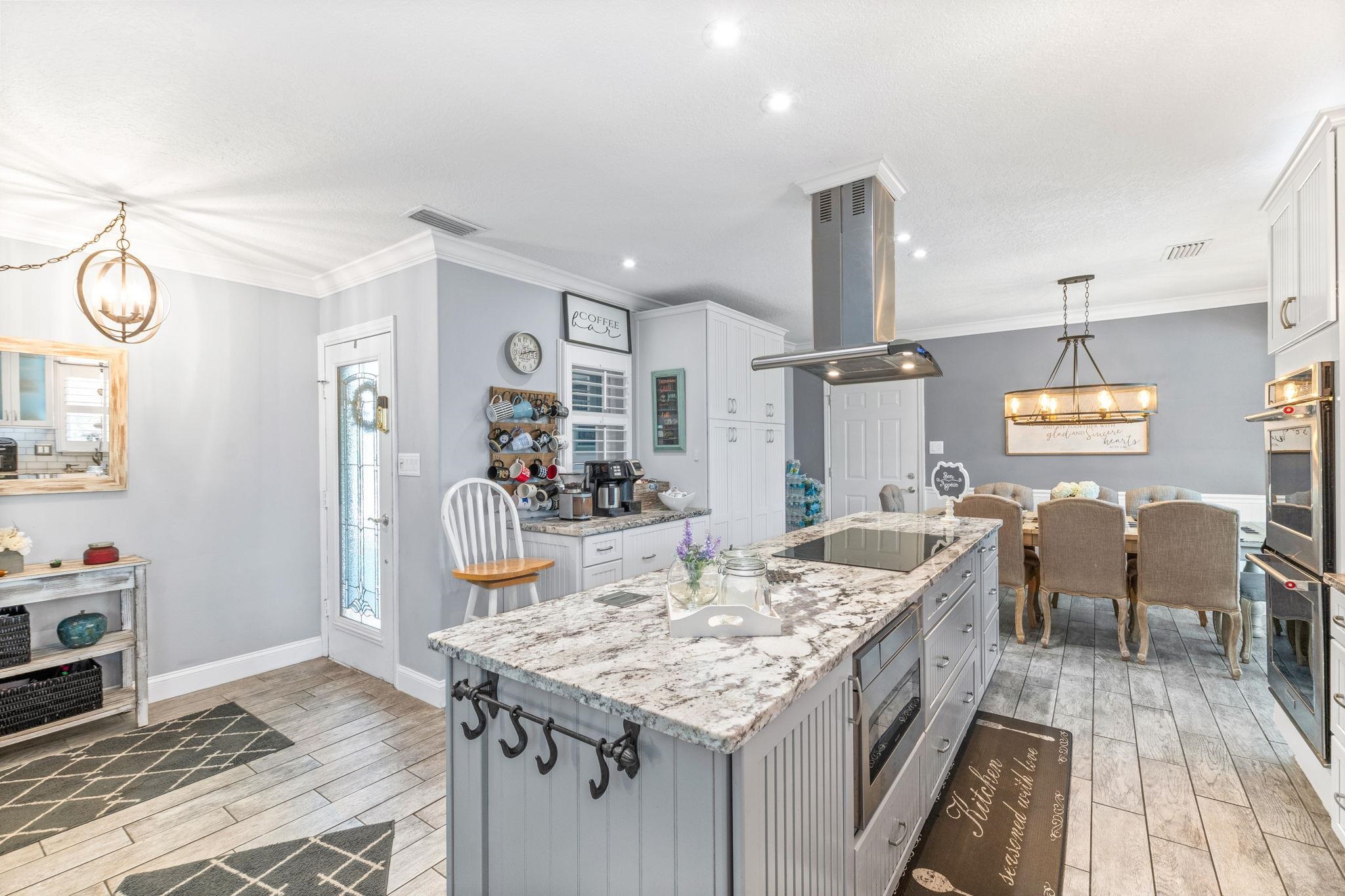 5312 Riverview Drive St. Augustine, FL 32080 - Photo 15 of 54 a dining table with chairs and kitchen view