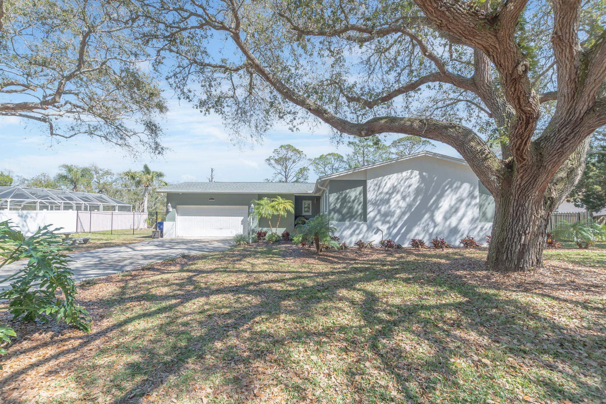 5312 Riverview Drive St. Augustine, FL 32080 - Photo 2 of 54 a view of a yard and front view of a house