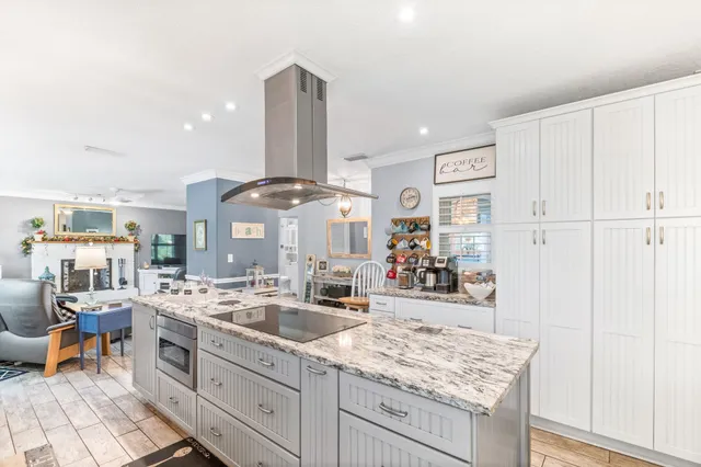 a kitchen with a stove top oven a sink and dishwasher