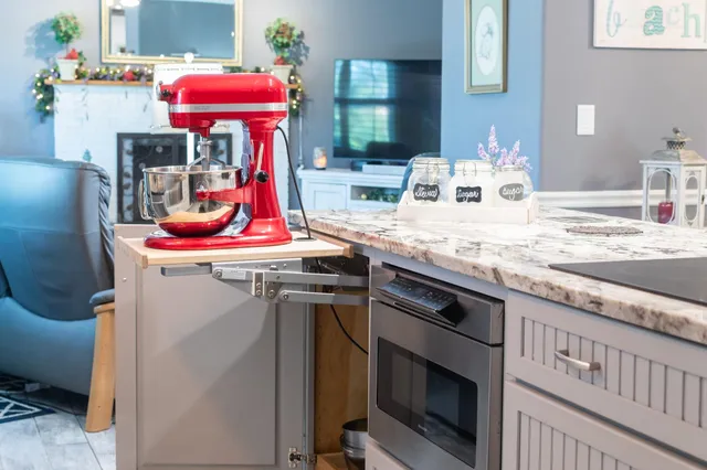 a bathroom with a sink mirror and vanity