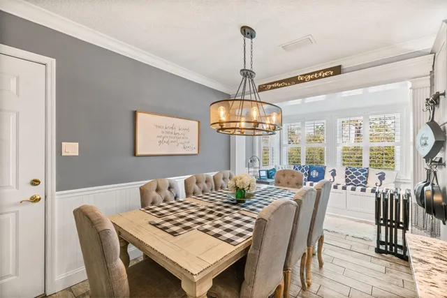 a kitchen with furniture and windows