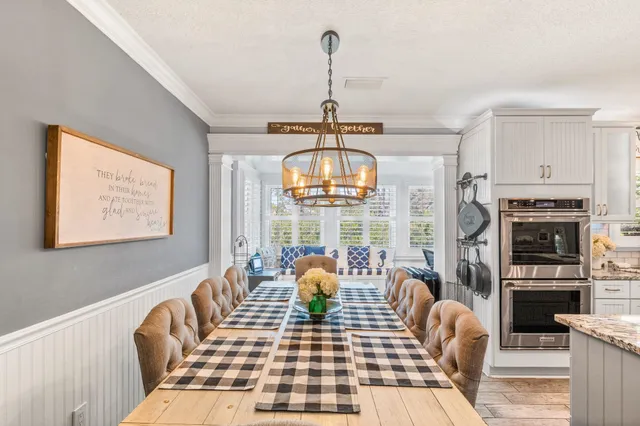 a bedroom with a bed and a chair