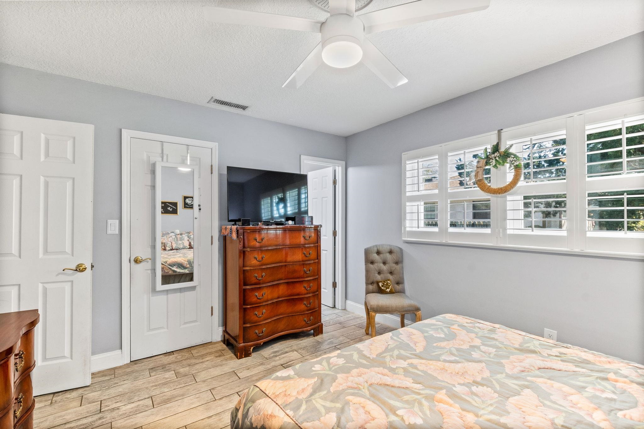 5312 Riverview Drive St. Augustine, FL 32080 - Photo 35 of 54 a bedroom with a bed and a chandelier