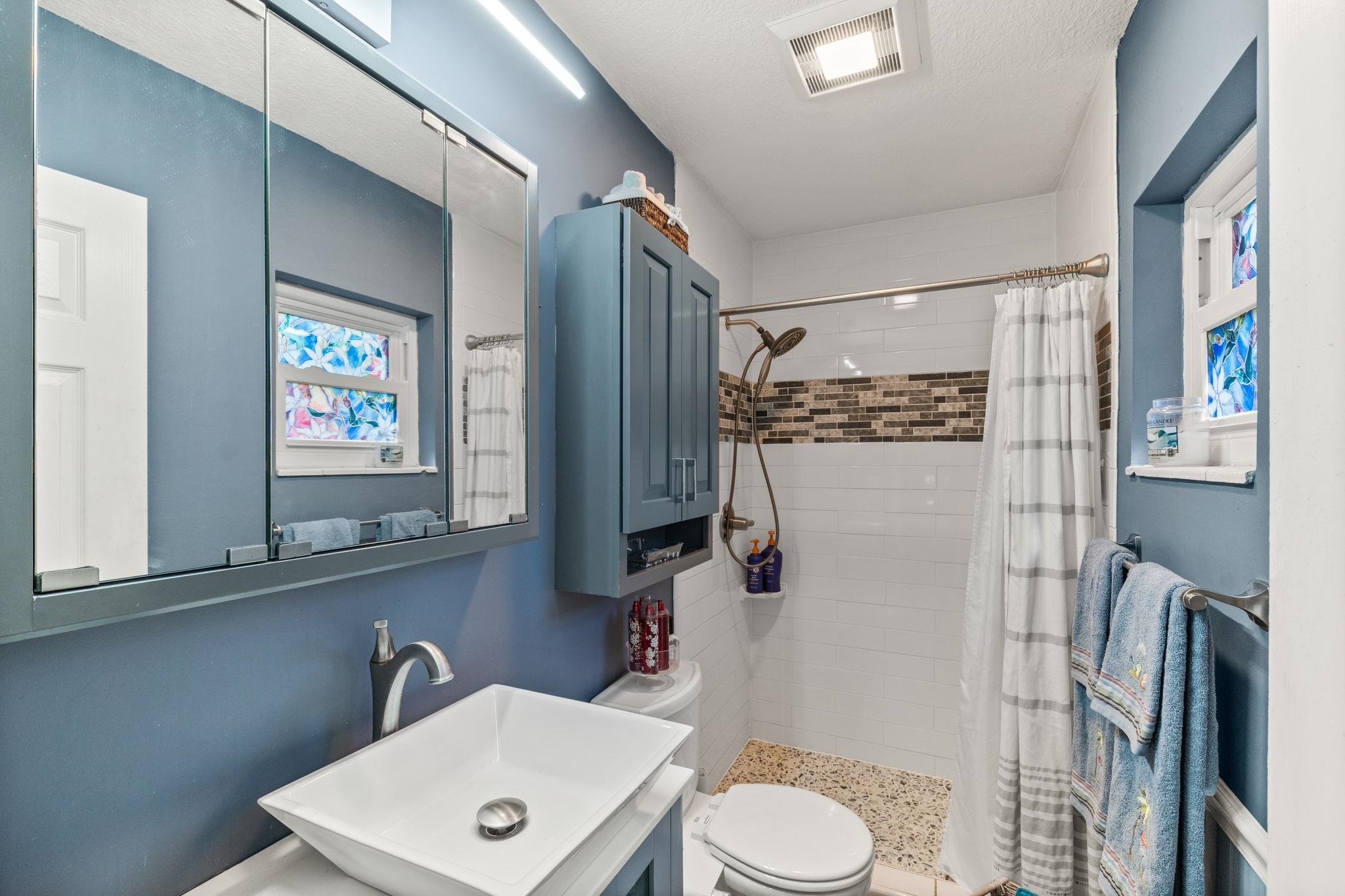 5312 Riverview Drive St. Augustine, FL 32080 - Photo 36 of 54 a bathroom with a sink toilet and shower