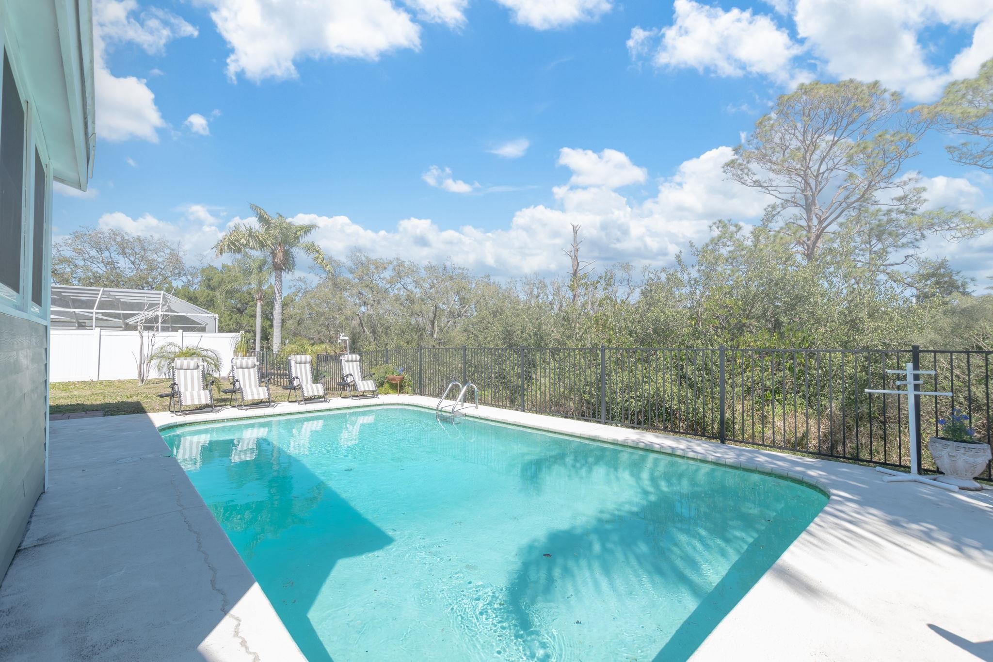 5312 Riverview Drive St. Augustine, FL 32080 - Photo 44 of 54 a view of a swimming pool with a yard