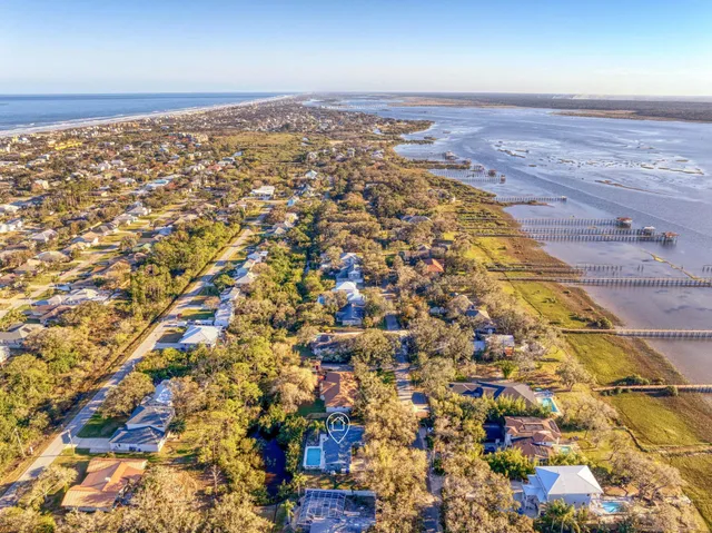 a view of a house with swimming pool and sitting area