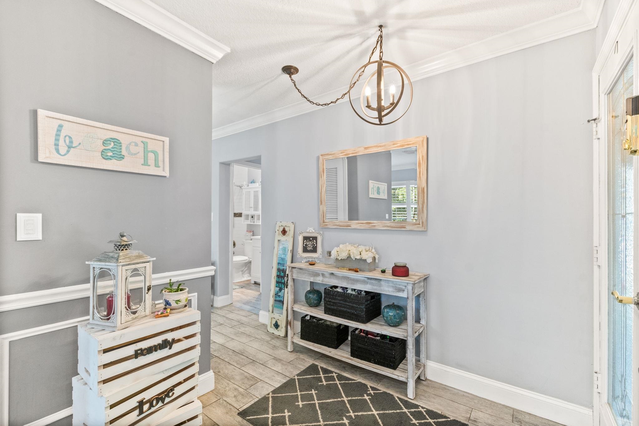 5312 Riverview Drive St. Augustine, FL 32080 - Photo 10 of 54 a view of a dining room with furniture and a chandelier