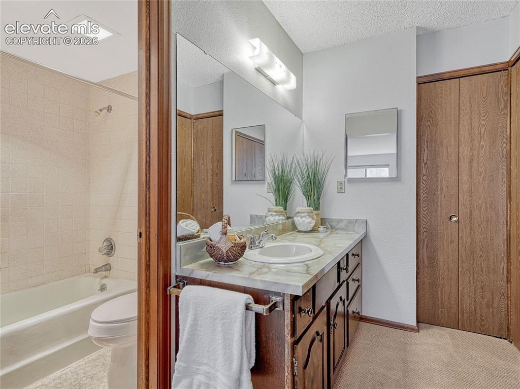 1146 Fontmore Road, Unit A Colorado Springs, CO 80904 - Photo 20 of 24 a dining room with a table and chairs