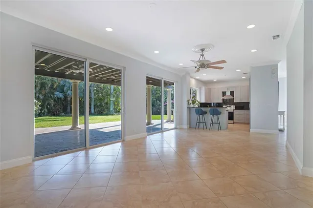 a view of a livingroom with a furniture and floor to ceiling window