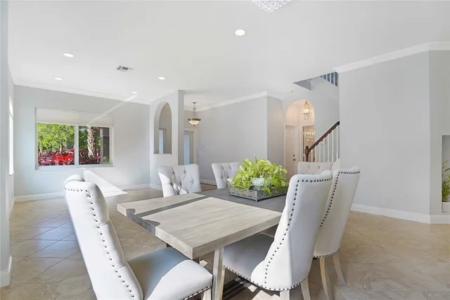 a view of a livingroom with furniture and a ceiling fan
