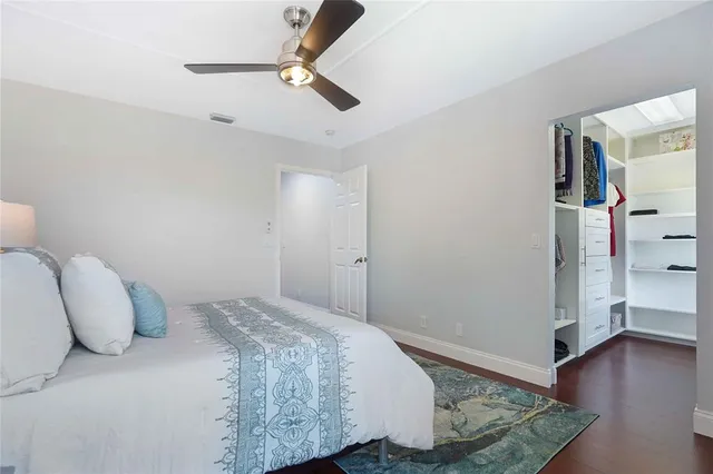 a bathroom with a granite countertop sink a mirror and a shower