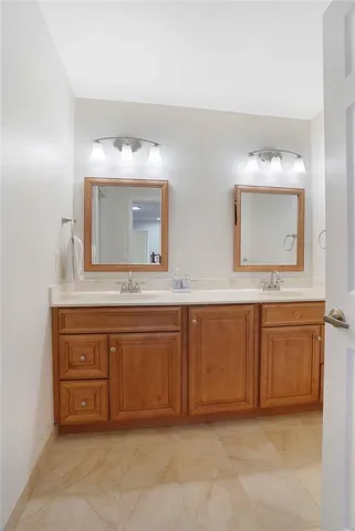 a view of a backyard with potted plants and large tree