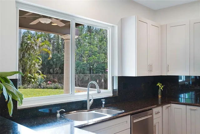 a view of a window and chair in the kitchen