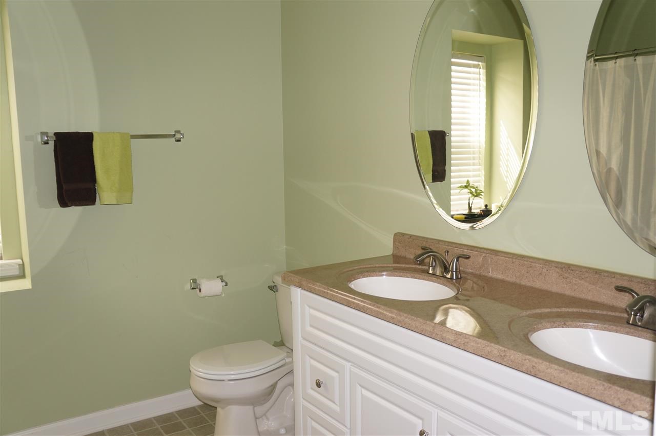 177 Ryder Cup Circle Raleigh, NC 27603 - Photo 17 of 25 2 full baths upstairs both feature 39" high cabinets with solid surface countertops and double sinks!