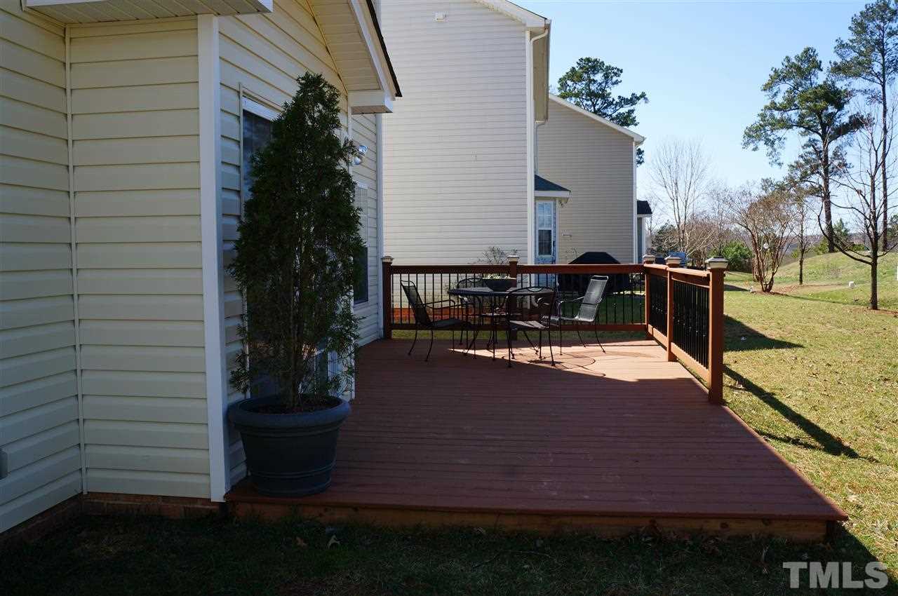 177 Ryder Cup Circle Raleigh, NC 27603 - Photo 4 of 25 Sliding doors off the kitchen area lead to this large deck, and open back yard! One of the best back yards in the community!
