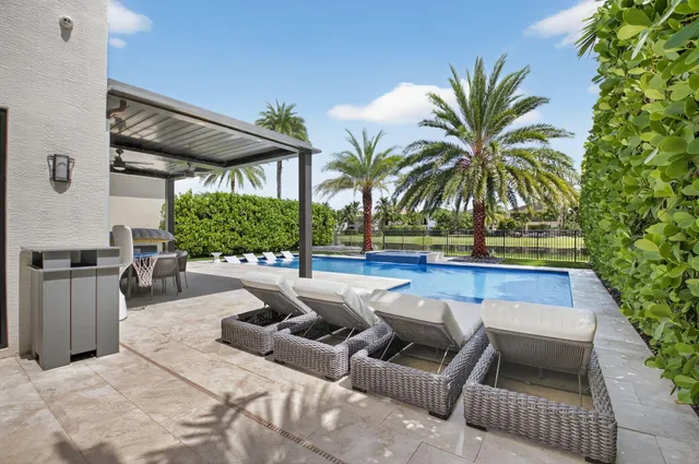 a view of living room with stainless steel appliances granite countertop furniture and a fireplace