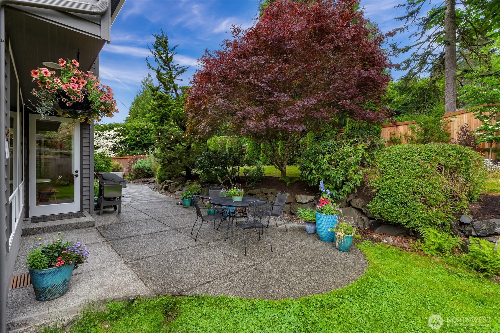 2029 240th Place Southeast Bothell, WA 98021 - Photo 34 of 39 a view of a patio with a table and a chairs