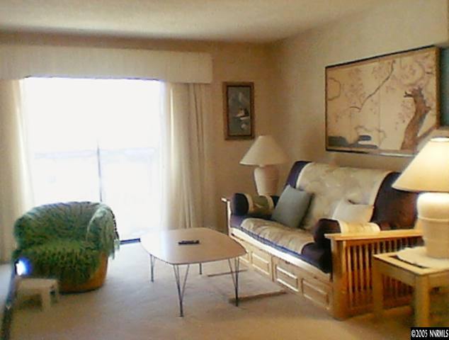 1000 Beck Drive Reno, NV 89509 - Photo 2 of 7 a living room with furniture and a window