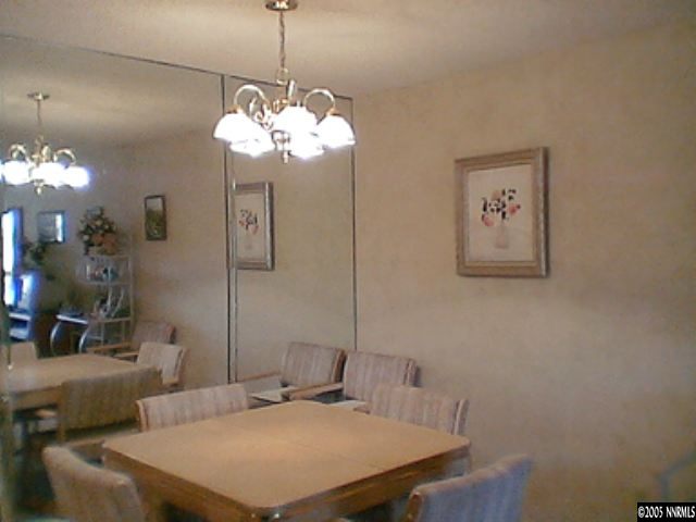 1000 Beck Drive Reno, NV 89509 - Photo 5 of 7 a view of a room with a chandelier furniture and windows