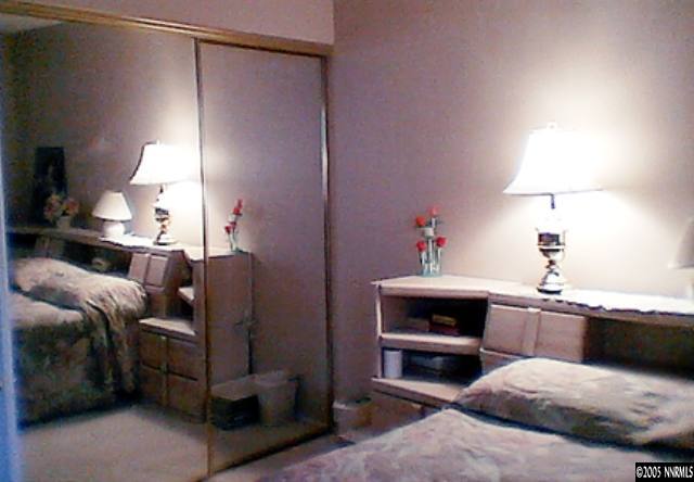1000 Beck Drive Reno, NV 89509 - Photo 6 of 7 a bedroom with a bed and a chandelier