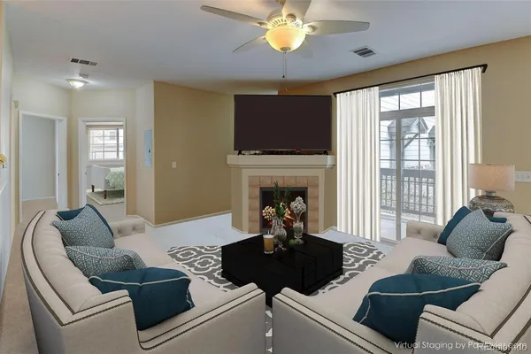 a living room with furniture and a fireplace