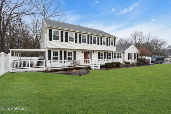 a kitchen with stainless steel appliances granite countertop a refrigerator a stove a sink and a wooden cabinets