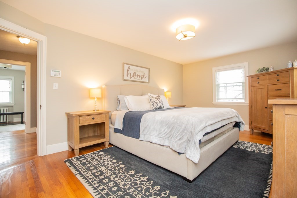 66 Howitt Road Boston, MA 02132 - Photo 11 of 24 a bedroom with a bed and a couch