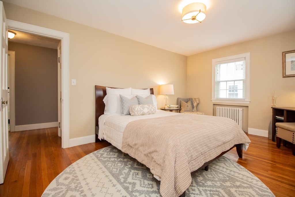 66 Howitt Road Boston, MA 02132 - Photo 12 of 24 a bedroom with bed and window