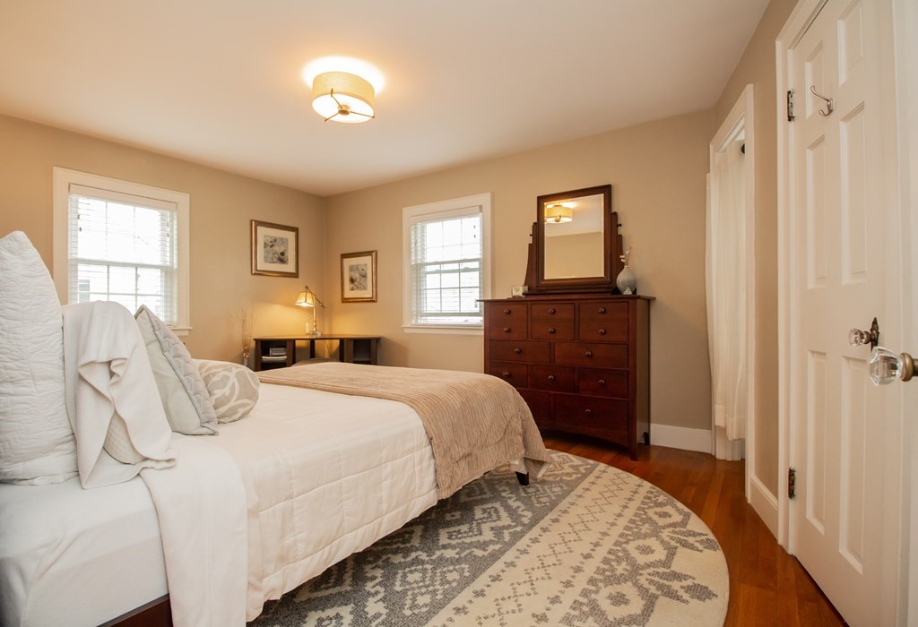 66 Howitt Road Boston, MA 02132 - Photo 13 of 24 a bedroom with a bed and a window