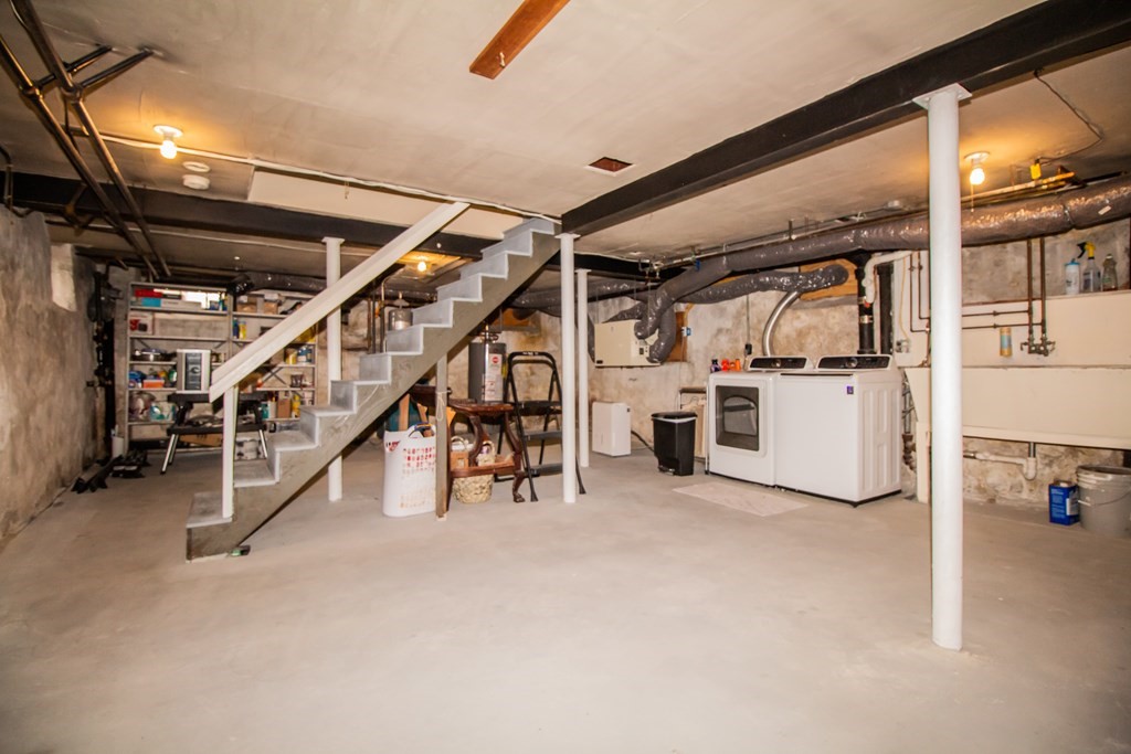 66 Howitt Road Boston, MA 02132 - Photo 19 of 24 a view of an empty room with white cabinets