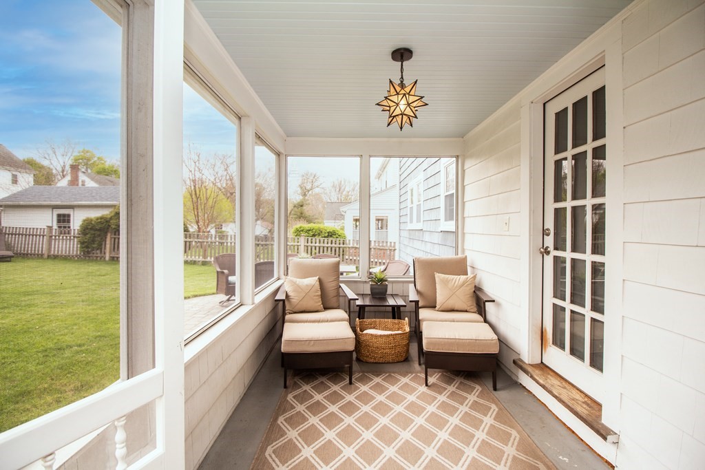 66 Howitt Road Boston, MA 02132 - Photo 20 of 24 a living room with furniture and a floor to ceiling window