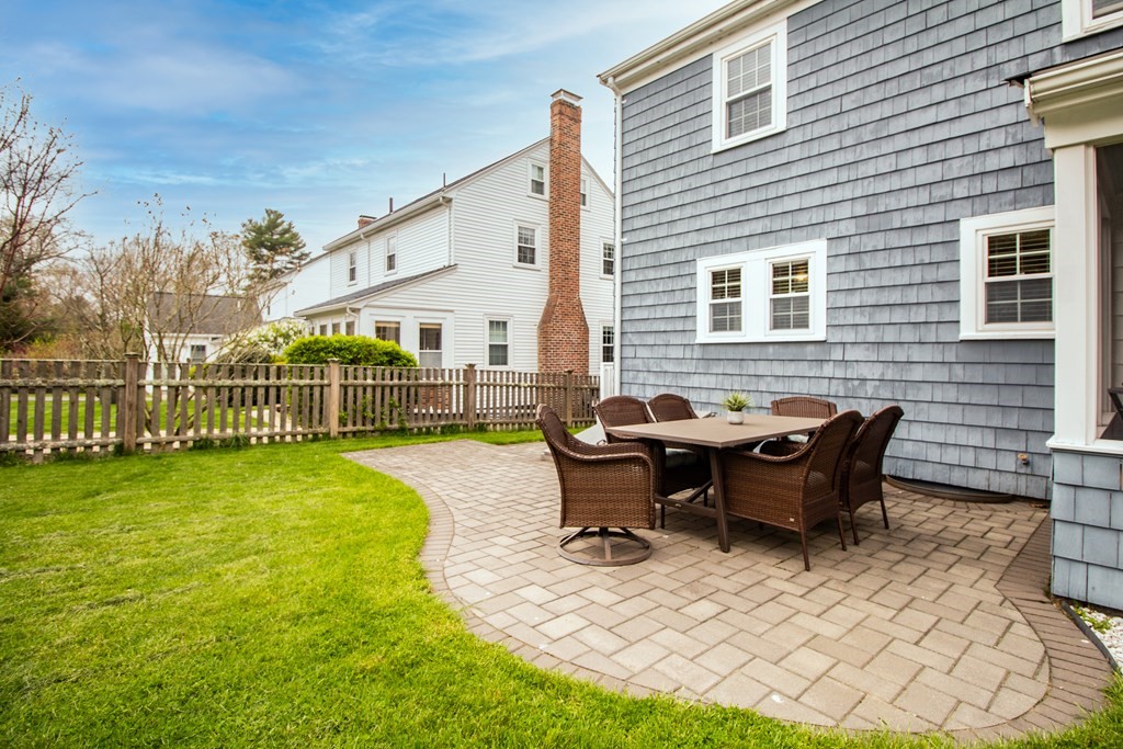 66 Howitt Road Boston, MA 02132 - Photo 22 of 24 a view of a house with backyard and sitting area