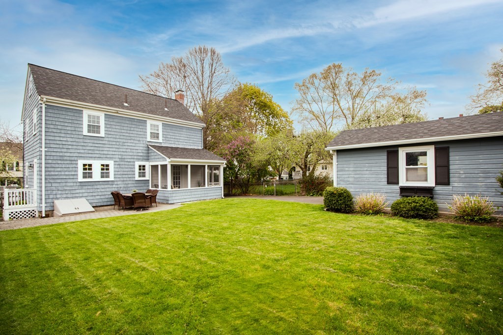 66 Howitt Road Boston, MA 02132 - Photo 23 of 24 a view of a house with a backyard
