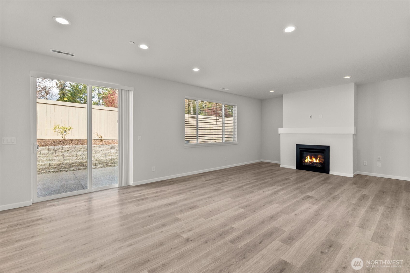 9116 Carlos Way Northeast Lacey, WA 98516 - Photo 12 of 34 an empty room with windows and fireplace