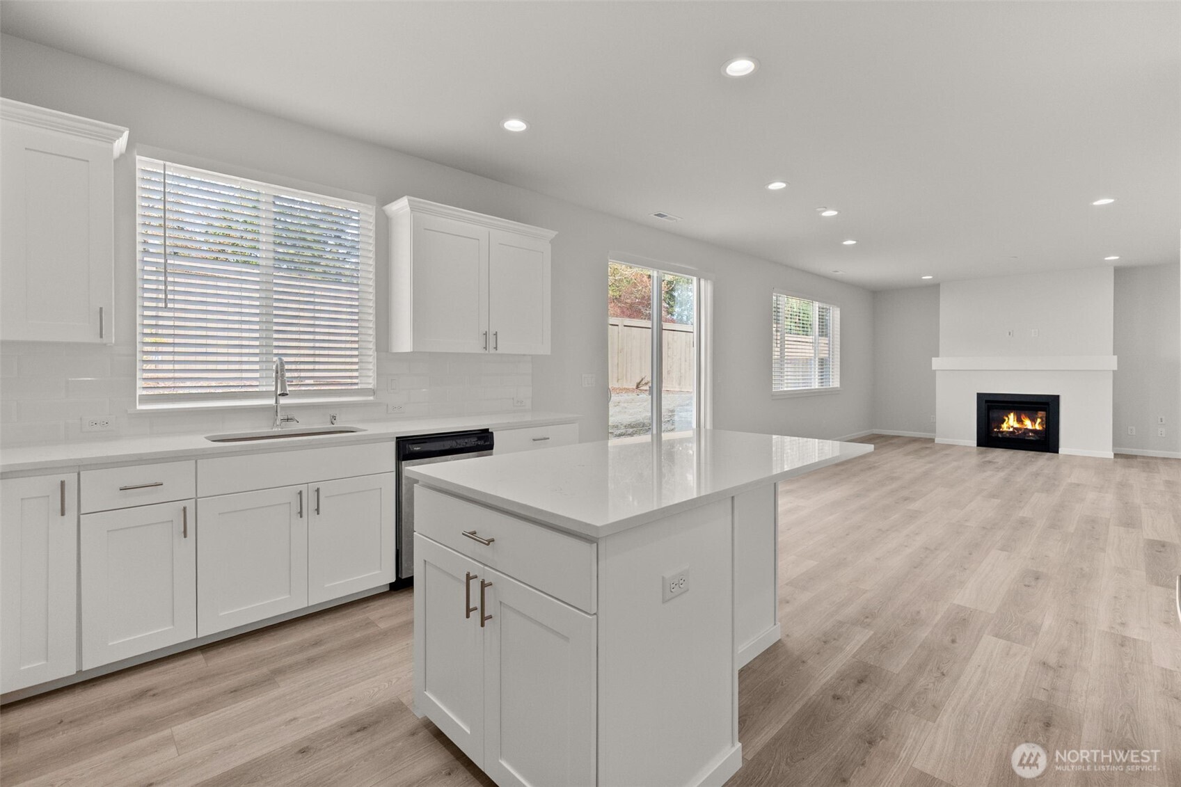 9116 Carlos Way Northeast Lacey, WA 98516 - Photo 17 of 34 a kitchen with white cabinets and wooden floor