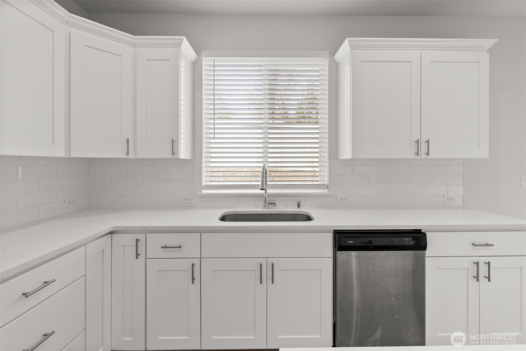 9116 Carlos Way Northeast Lacey, WA 98516 - Photo 18 of 34 a kitchen with white cabinets and a window