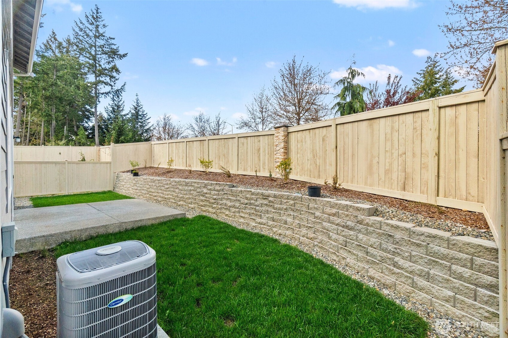 9116 Carlos Way Northeast Lacey, WA 98516 - Photo 32 of 34 a view of a backyard with wooden fence