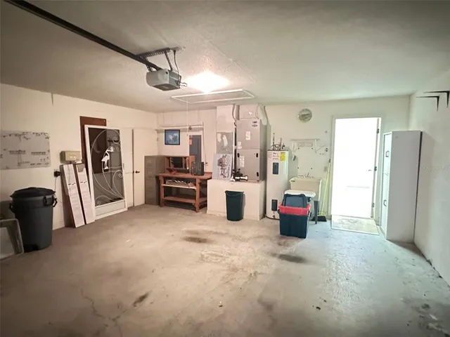 a view of livingroom with furniture and refrigerator
