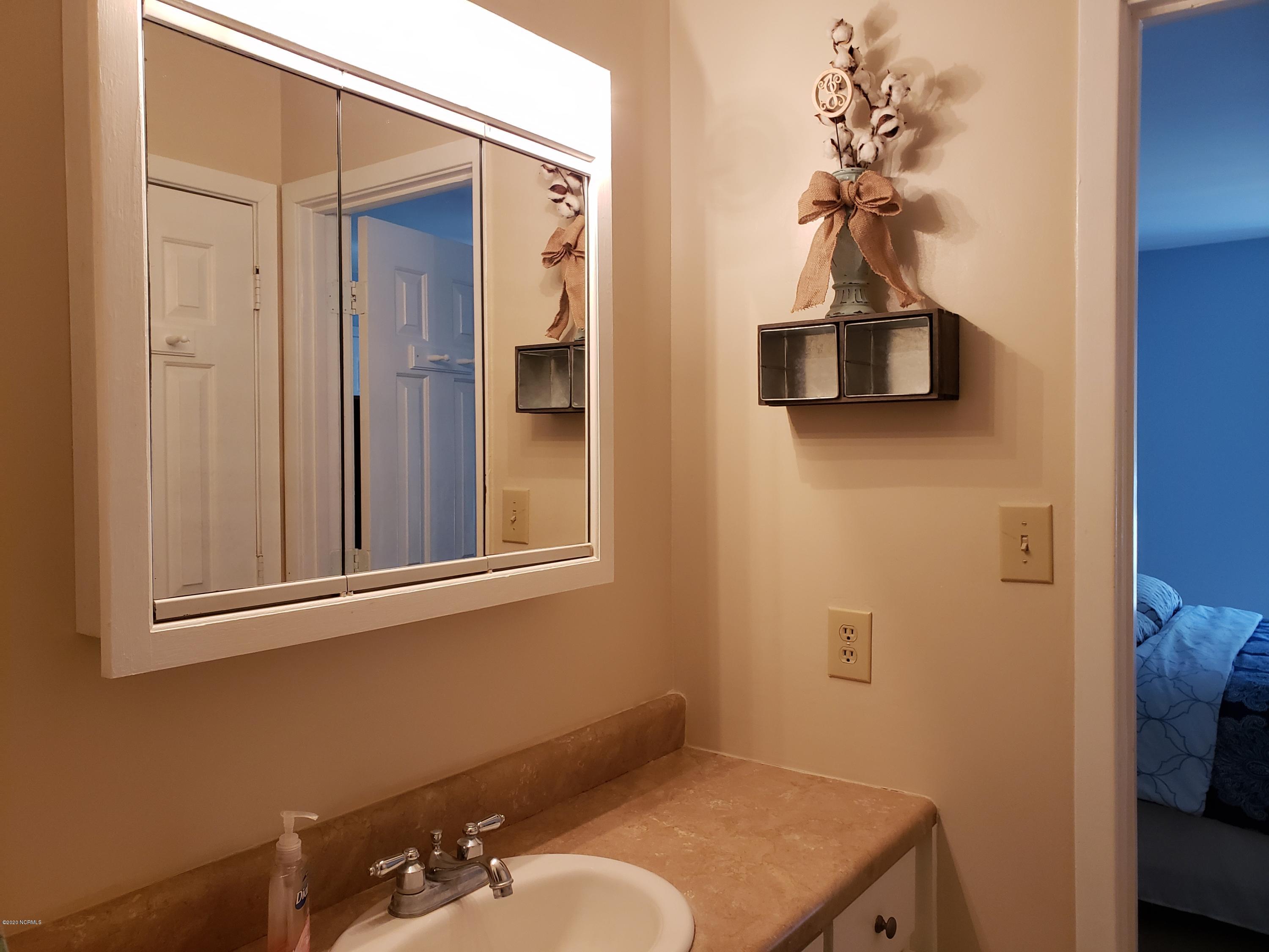 1806 Paulette Road Morehead City, NC 28557 - Photo 16 of 39 Bathroom 1 is off the bedroom and also opens to the hallway