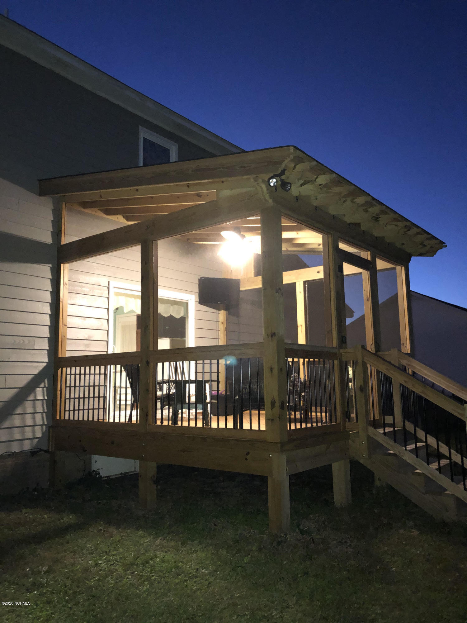 1806 Paulette Road Morehead City, NC 28557 - Photo 26 of 39 Screened deck is beautiful in the evenings